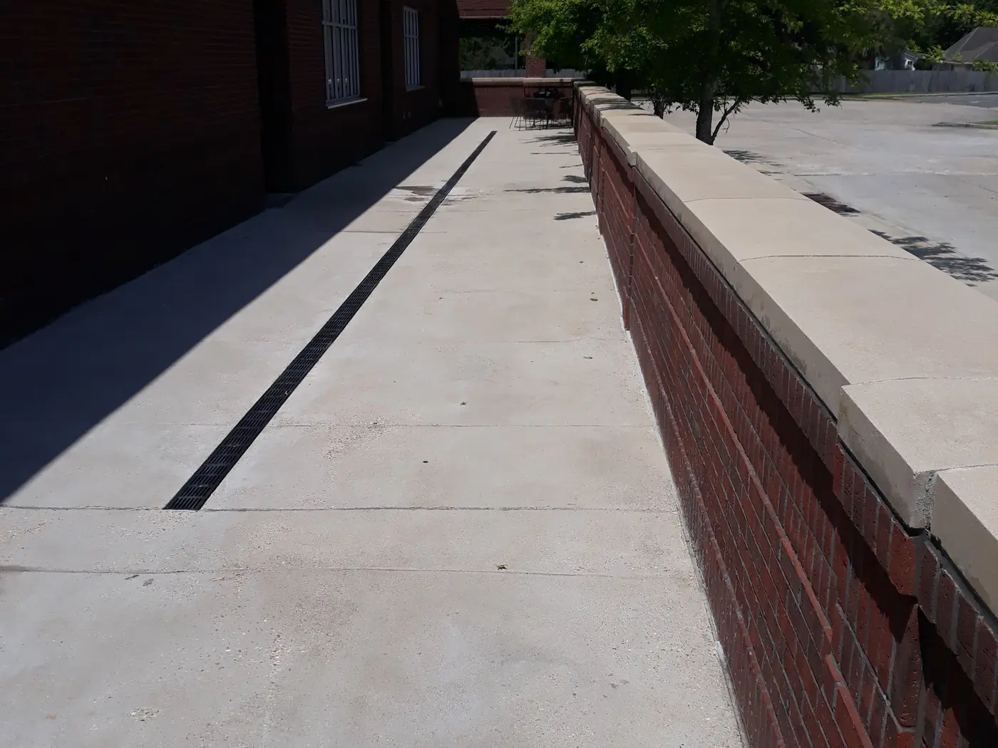 The same walkway after surface cleaning, with a consistent, clean finish.
